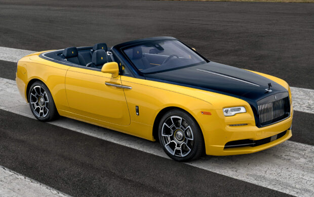 A yellow and black Rolls Royce Dawn car is parked on the road showing its side profile, HD Desktop Wallpaper