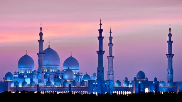 The majestic mosque architecture at twilight showcasing Abu Dhabi skyline