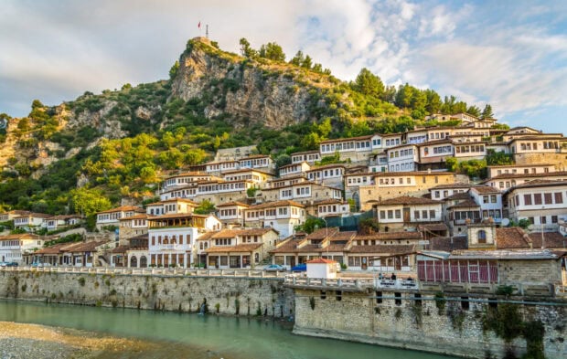 Traditional Albanian houses on a hillside by the river in Albania