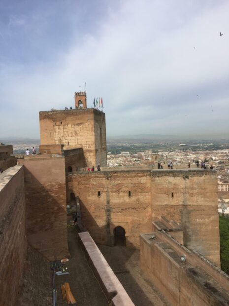 Ancient Alhambra fortress tower overlooking the city and clear sky