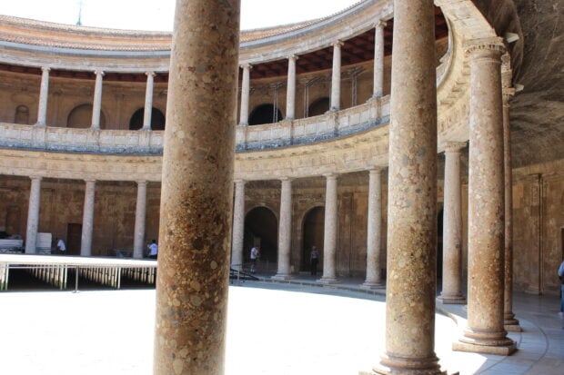 The circular courtyard with stone columns at Alhambra palace in Spain