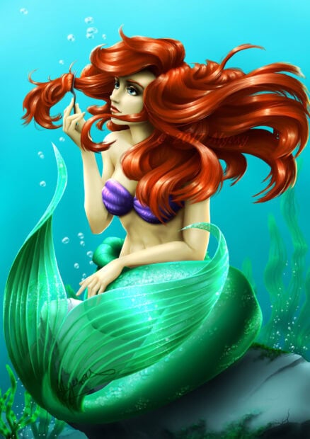 Ariel the little mermaid with flowing red hair under the sea holding a fork in her hand
