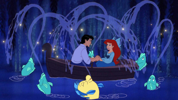 Ariel and Eric share a romantic moment in a boat surrounded by glowing fish and water splashes