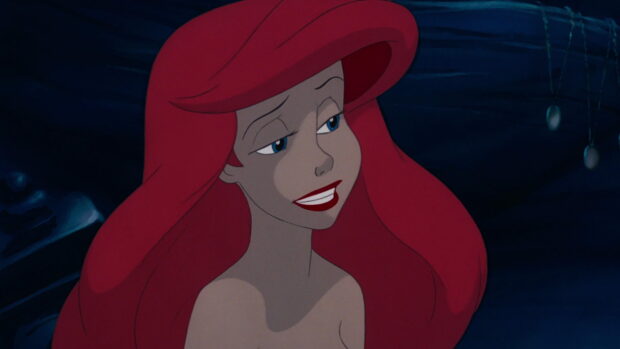Ariel from The Little Mermaid with vibrant red hair and a smiling face