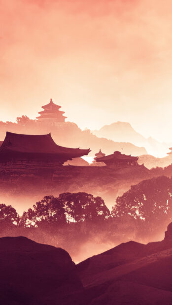 Ancient Asia architecture surrounded by trees and mountains in warm tones