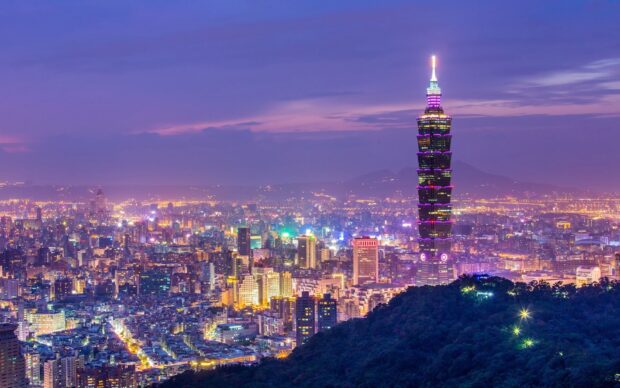 Taipei cityscape with tall skyscraper and vibrant evening sky