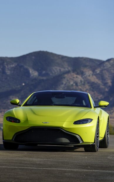 Front view of Aston Martin Vantage sports car in bright green color