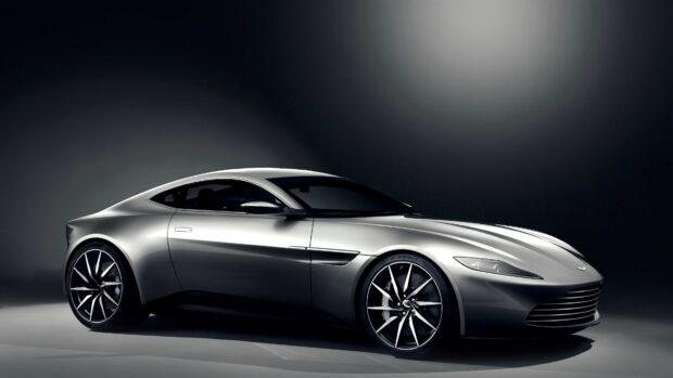 Silver Aston Martin Vantage sports car with sleek design in studio lighting