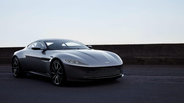 Sleek Aston Martin Vantage parked on road with clear sky background