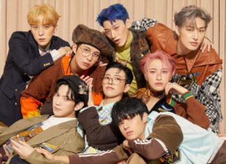 Ateez group members posing together in colorful outfits