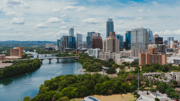 Austin skyline with river and urban buildings in clear daylight