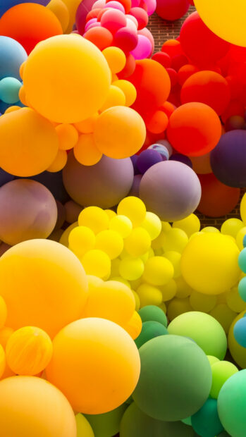 Colorful balloons in various shades floating together creating a vibrant scene