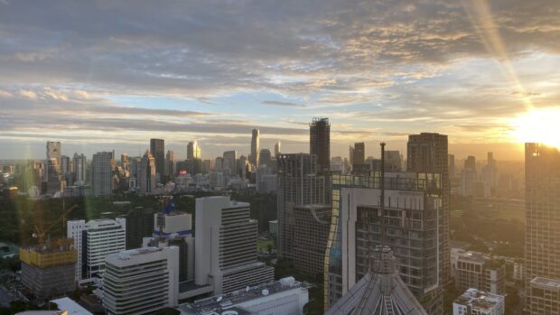 Bangkok skyline viewed at sunset with modern skyscrapers and a vibrant cityscape silhouette