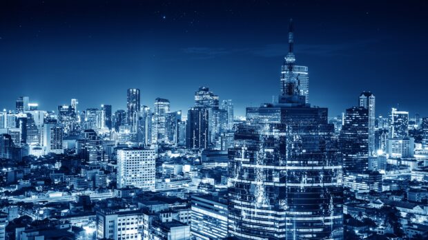 Stunning view of Bangkok skyline with skyscrapers illuminated at night in a vibrant cityscape