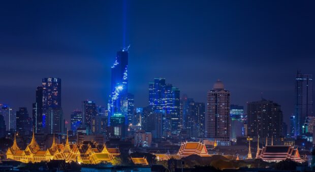 Night view of Bangkok skyline with landmark buildings at dusk including Bangkok skyline