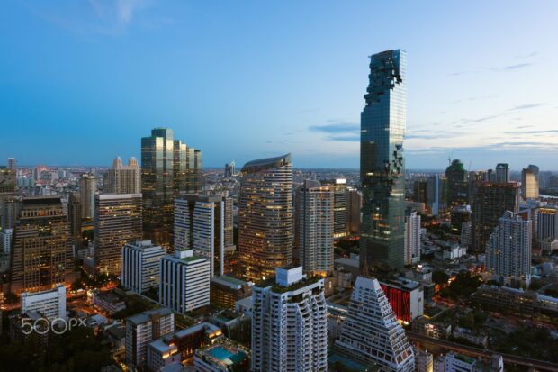 Modern Bangkok skyline with famous landmarks and urban buildings at dusk