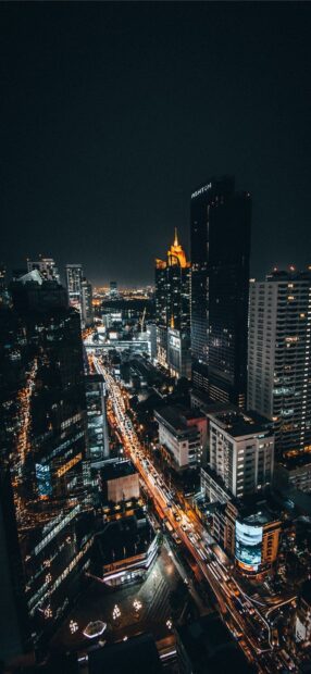 Night view of Bangkok city with busy traffic and high rise buildings in cityscape