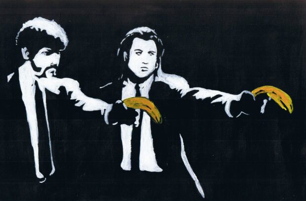 Banksy artwork showing two men pointing bananas like guns in black and white style