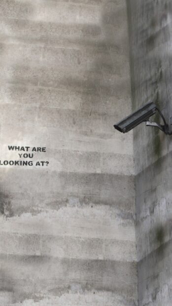 Banksy Wallpaper HD Mobile What are Banksy graffiti and surveillance camera on a concrete wall