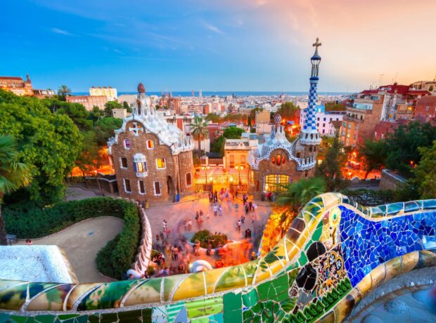 Gaudi style architecture and colorful mosaic tiles in Barcelona cityscape at sunset view