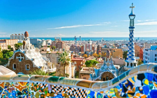 The unique architecture of Barcelona city with colorful mosaic tiles in the foreground