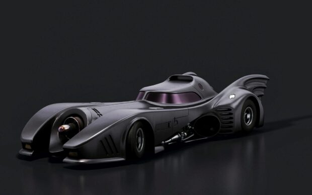 A sleek Batmobile with aerodynamic design in a dark setting showcasing the Batmobile