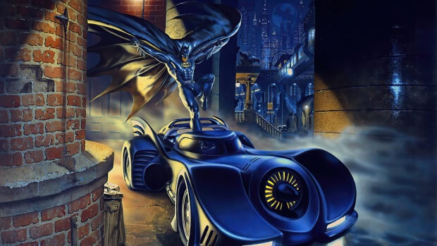 Batman standing on the Batmobile in a dark city alley with the moon in the background