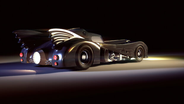 Classic Batmobile model shown from the rear with distinctive winged fins on a dark background
