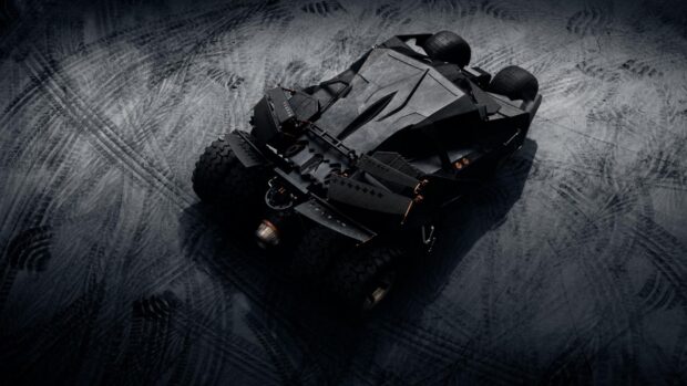 A detailed Batmobile vehicle on rugged terrain viewed from above