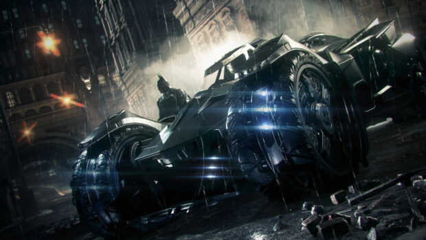 A batmobile with Batman standing behind it in a dark rainy cityscape