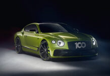 A green Bentley Continental showcasing sleek design and luxury features in a studio setting