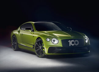 A green Bentley Continental showcasing sleek design and luxury features in a studio setting