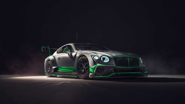 Sleek Bentley Continental racing car with green accents on a dark background