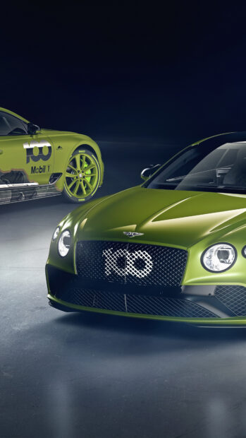 Green Bentley Continental with racing decals parked on dark floor