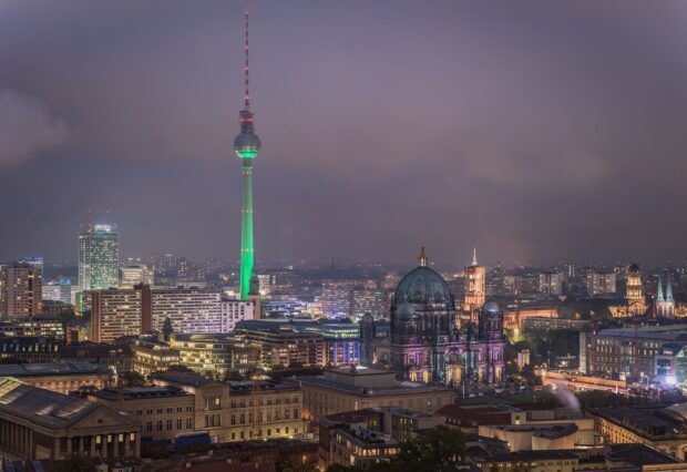 Berlin skyline with the iconic Fernsehturm tower and historic cathedral illuminated at night