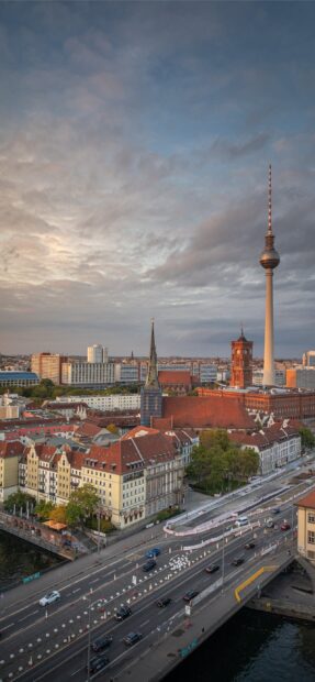 Historic berlin skyline with tv tower and urban streets at sunset