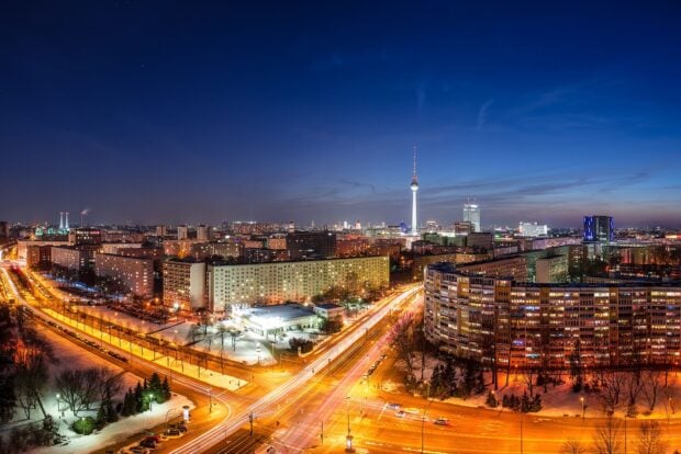 Berlin skyline at night with illuminated streets and high rise buildings