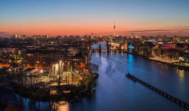 Berlin skyline with river and city lights at sunset in high definition