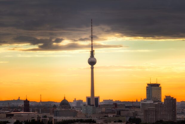 Berlin skyline at sunset with the famous television tower standing tall among city buildings