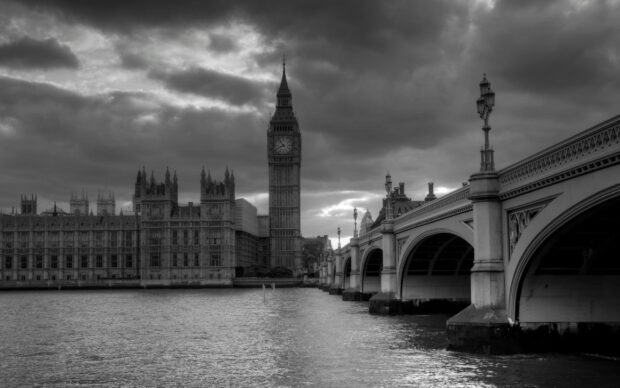 The iconic Big Ben tower and the Houses of Parliament under a cloudy sky