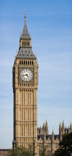 Close up view of the Big Ben clock tower architecture under blue sky