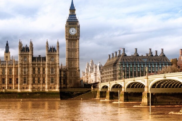 The iconic Big Ben clock tower and surrounding buildings along the river Thames in London