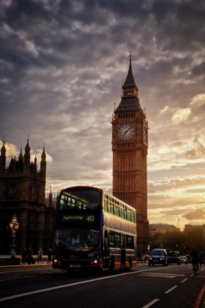 Big Ben and a double decker bus viewed during sunset in London