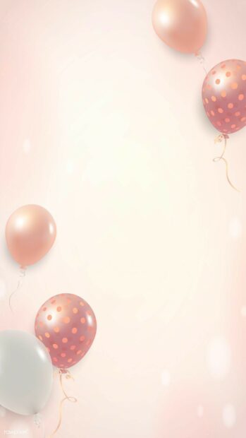 Soft pink and white polka dot balloons floating gently in a birthday party design