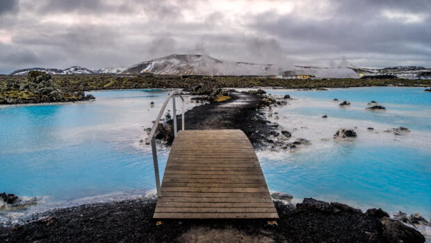 A scenic view of the Blue Lagoon Iceland with steaming waters and volcanic landscape