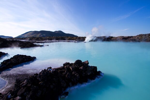 Blue Lagoon Iceland natural geothermal spa with bright blue water and volcanic rocks