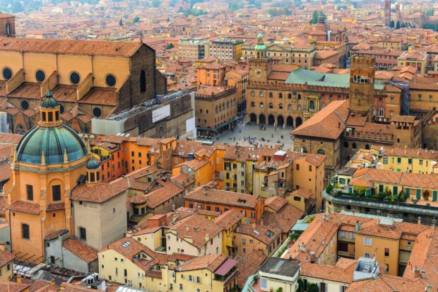 A panoramic view of historic architecture and rooftops in Bologna city center