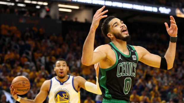 Boston Celtics player reacting during a basketball game against Golden State Warriors