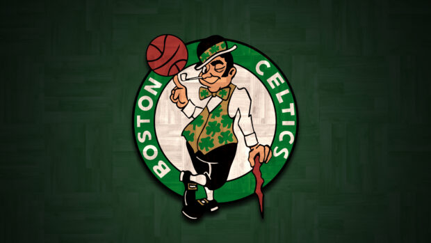 The Boston Celtics logo with a leprechaun spinning a basketball on his finger on a green wooden floor background