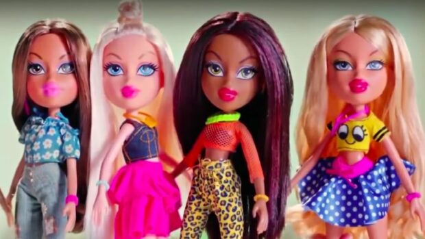 Four Bratz dolls posing in colorful outfits with various hairstyles and makeup styles